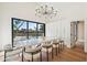Spacious dining area with water views and modern chandelier at 8133 E Cortez Dr, Scottsdale, AZ 85260