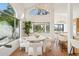 Bright dining room with large windows and water views at 8133 E Cortez Dr, Scottsdale, AZ 85260