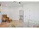 Home office with glass desk, comfortable chair, and view to upper level at 8133 E Cortez Dr, Scottsdale, AZ 85260