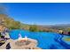 Inviting pool and fire pit with panoramic mountain views at 5802 E Cholla Ln, Paradise Valley, AZ 85253