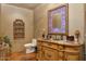 Powder room with ornate vanity and decorative mirror at 5802 E Cholla Ln, Paradise Valley, AZ 85253