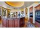 Modern kitchen with double ovens, granite island, and custom cabinetry at 5802 E Cholla Ln, Paradise Valley, AZ 85253