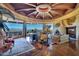 Elegant living room boasts a fireplace and large windows with panoramic views at 5802 E Cholla Ln, Paradise Valley, AZ 85253