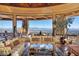 Living area showcases scenic views through large windows and comfortable seating at 5802 E Cholla Ln, Paradise Valley, AZ 85253