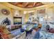 Living room with fireplace, comfortable seating, and large windows showcasing a view at 5802 E Cholla Ln, Paradise Valley, AZ 85253