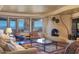 Grand living room with stone fireplace and city views at 5802 E Cholla Ln, Paradise Valley, AZ 85253