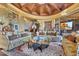 Elegant living room boasts a high, ornate ceiling and comfortable seating at 5802 E Cholla Ln, Paradise Valley, AZ 85253