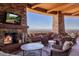 Cozy patio with fireplace and stunning mountain views at 5802 E Cholla Ln, Paradise Valley, AZ 85253