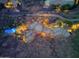 Night time aerial view of a unique home with a curved design and a pool at 5802 E Cholla Ln, Paradise Valley, AZ 85253