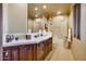 Bathroom with double vanity and tiled shower/tub at 5802 E Cholla Ln, Paradise Valley, AZ 85253