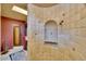 Large tiled shower with built-in seat and niche at 5802 E Cholla Ln, Paradise Valley, AZ 85253