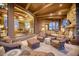Spacious outdoor patio with seating area and fireplace, offering stunning views at 5802 E Cholla Ln, Paradise Valley, AZ 85253