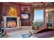 Main bedroom with fireplace, TV, and mountain views at 5802 E Cholla Ln, Paradise Valley, AZ 85253