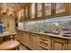 Well-equipped kitchen featuring granite countertops and custom cabinetry at 5802 E Cholla Ln, Paradise Valley, AZ 85253
