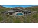 Stunning aerial view of modern home, pool, and desert landscape at 10023 E Filaree Ln, Scottsdale, AZ 85262