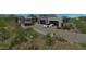 Modern home with a spacious driveway and desert landscaping at 10023 E Filaree Ln, Scottsdale, AZ 85262