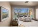 Charming bedroom with mountain views, a bed, and a large window at 10119 E Horizon Dr, Scottsdale, AZ 85262