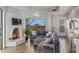 Comfortable living room with a fireplace, large windows, and a sectional sofa at 10119 E Horizon Dr, Scottsdale, AZ 85262