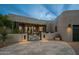 Elegant home exterior with a courtyard entrance at dusk at 10119 E Horizon Dr, Scottsdale, AZ 85262