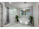 Luxurious bathroom features a freestanding tub, walk-in shower, and marble floors at 10119 E Horizon Dr, Scottsdale, AZ 85262