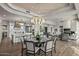 Gourmet kitchen boasts expansive island, stainless steel appliances, and white cabinetry at 10119 E Horizon Dr, Scottsdale, AZ 85262