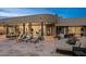 Expansive patio with comfortable seating, offering views of the home and landscape at 10119 E Horizon Dr, Scottsdale, AZ 85262