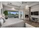 Bright bedroom with fireplace, stunning views, and built-in workspace at 10119 E Horizon Dr, Scottsdale, AZ 85262
