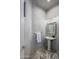 Elegant powder room featuring a pedestal sink and marble flooring at 10119 E Horizon Dr, Scottsdale, AZ 85262