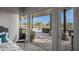 Cozy bedroom with outdoor access and stunning views of the landscape at 10119 E Horizon Dr, Scottsdale, AZ 85262