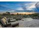 Luxury pool and patio with lounge chairs, offering scenic sunset views at 10119 E Horizon Dr, Scottsdale, AZ 85262