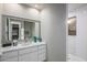 Bright bathroom with white cabinets, marble countertop, and a walk-in shower at 10119 E Horizon Dr, Scottsdale, AZ 85262
