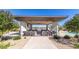Outdoor kitchen with grills and bar seating near the pool at 1301 W Via De Olivos --, Queen Creek, AZ 85140