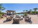 Relaxing fire pit area with comfortable seating near the pool at 1301 W Via De Olivos --, Queen Creek, AZ 85140