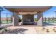 Covered outdoor grilling station and seating area near tennis courts at 1301 W Via De Olivos --, Queen Creek, AZ 85140