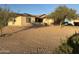 House exterior with solar panels and a spacious yard at 33202 W Ardmore Rd, Tonopah, AZ 85354