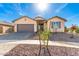 New single-story home with a two-car garage and landscaped front yard at 1171 E Ridgerock St, Casa Grande, AZ 85122