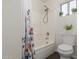 Simple bathroom with shower/tub combo and patterned curtain at 1234 E Washington Ave, Gilbert, AZ 85234