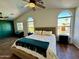 Spacious main bedroom with dark green accent wall and large windows at 1234 E Washington Ave, Gilbert, AZ 85234