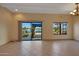 Comfortable living space with large windows showcasing the scenic waterfront view at 13869 N Buccaneer Way, Sun City, AZ 85351