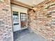 Brick front exterior with a wood door and small covered entryway at 1451 N Spencer --, Mesa, AZ 85203