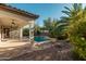 Inviting backyard oasis with sparkling pool, waterfall, and covered patio at 2717 W Nighthawk Way, Phoenix, AZ 85045