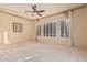 Bright bedroom with neutral carpeting and plantation shutters at 2717 W Nighthawk Way, Phoenix, AZ 85045