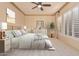Comfortable bedroom with neutral decor and plantation shutters at 2717 W Nighthawk Way, Phoenix, AZ 85045