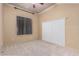 Bright bedroom with carpeted floors and built-in shelving at 2717 W Nighthawk Way, Phoenix, AZ 85045