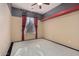 Bedroom with red and gray accent walls and carpet flooring at 2717 W Nighthawk Way, Phoenix, AZ 85045