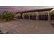 Three-car garage and driveway of a single story house at 2717 W Nighthawk Way, Phoenix, AZ 85045