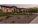 Elegant home exterior at dusk, showcasing landscaping and entryway at 2717 W Nighthawk Way, Phoenix, AZ 85045