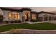 Evening view of the home exterior with attractive landscaping and lighting at 2717 W Nighthawk Way, Phoenix, AZ 85045