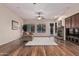 Spacious living room with hardwood floors, fireplace, and access to backyard at 2717 W Nighthawk Way, Phoenix, AZ 85045