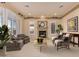 Bright living room with fireplace and large windows at 2717 W Nighthawk Way, Phoenix, AZ 85045